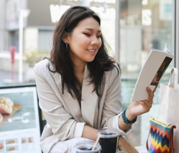 pretty-young-woman-reading-magazine